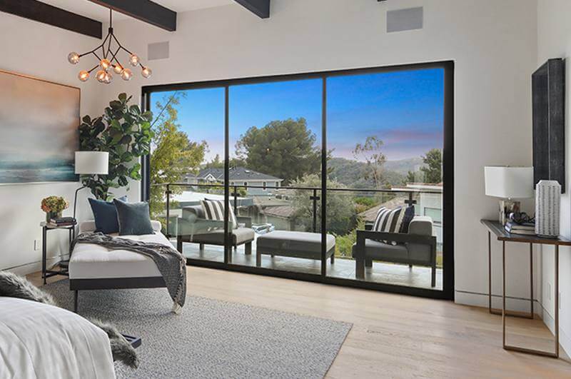 Bedroom glass door balcony overlooking hill